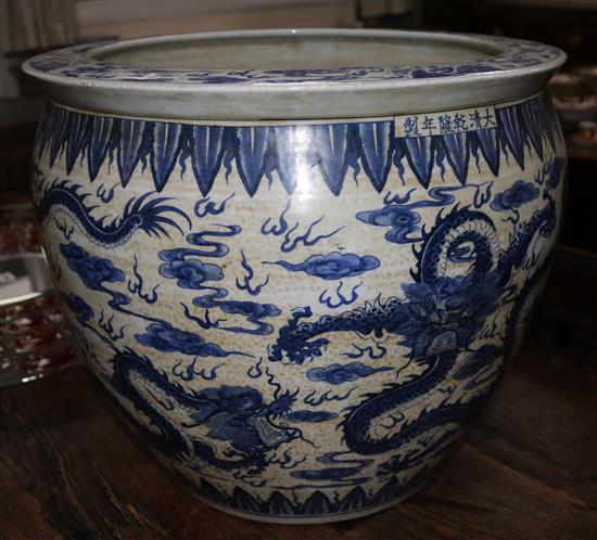 A Chinese blue and white dragon fish bowl